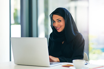 Image showing Entrepreneurship, laptop and woman in portrait with muslim from dubai with a smile for technology. Business, laptop and professional in hijab at an office for a career at an agency for web design.