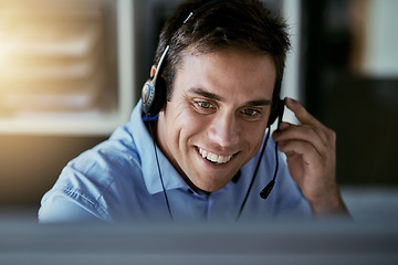 Image showing Call center agent, computer and happy man consulting with advice, sales or help desk worker with headset. Phone, conversation and happiness, customer support consultant at crm agency with smile.