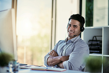 Image showing Help desk agent, smile and portrait of man with advice, confidence and happiness at at customer service agency. Happy phone call, conversation and callcenter consultant with headset in modern office.