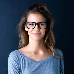Image showing Studio, teenager or portrait of a girl for fashion, beauty or eyewear with vision isolated on dark background. Style, happy or face of a beautiful young woman or confident model with glasses or smile