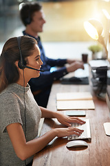 Image showing Call center, smile and typing with woman at computer for customer service, help desk or consulting. Happy, advisory and ecommerce with employee in office for contact us, telemarketing or receptionist