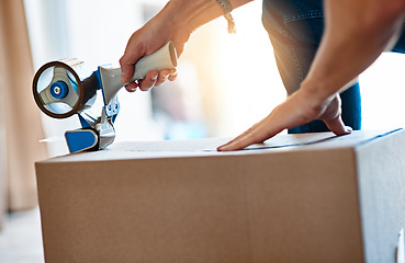 Image showing Closeup, cardboard and man with tape, box and move with items, home and shipping parcel. Zoom, male person and guy with tool, seal package or hands with products, closing or relocation with property