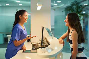 Image showing Medical, reception and nurse with patient in hospital for advice, help and information. Medicine, happy and healthcare with women at desk in clinic for nursing, waiting room and service