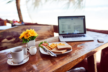 Image showing Laptop, travel or empty table at cafe for remote workspace in the morning with connection. Background, internet or seaside view coffee shop for digital blog online with brunch meal, tea or food