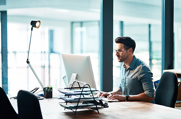 Image showing Business man, computer and focused in office for planning strategy, online research and typing at desk. Worker, desktop and website connection for digital project, internet software or admin analysis