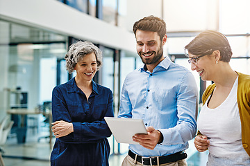 Image showing Happy business people, tablet and meeting in team collaboration, planning or coaching at the office. Group of employee workers working on technology with smile for teamwork, research or networking