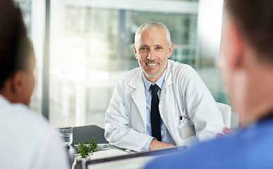 Image showing Portrait, man and doctor with team in office for meeting, clinic collaboration and leadership of medical partnership. Happy healthcare worker, manager and expert consulting with employees in hospital