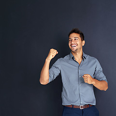 Image showing Mockup, happy man and winning fist in studio for success, victory or small business loan approval. Yes, hand and excited male entrepreneur celebrating good news or career milestone on grey background