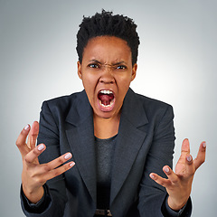 Image showing Anger, frustrated and portrait of black woman in studio for screaming, problem and crazy. Mental health, rage and angry with face of female model on gray background for shouting, stress and upset
