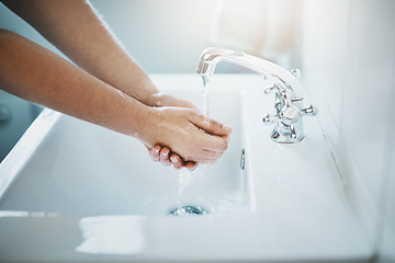 Image showing Hands, water and washing for clean and safe skin for wellness in the bathroom at home. Wash hand, woman and liquid for skincare, bacteria, cleaning and disinfection for germs with safety at house.