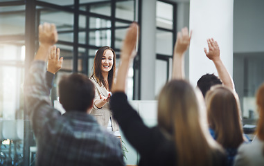 Image showing Happy audience, questions and business people at seminar, presentation and workshop in office. Woman, speaker and asking feedback from crowd of employees with hands raised at conference of convention