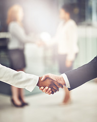 Image showing Deal, shaking hands and colleagues in office for partnership, corporate meeting or interview. Collaboration, team and closeup of business people with handshake for greeting or welcome in a workplace.