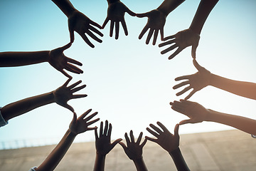 Image showing Teamwork, circle and blue sky with hands of people for support, community and help with bottom view. Collaboration, trust and motivation with closeup of friends for partnership, solidarity and faith