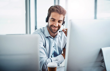 Image showing Call center, employee and man with telemarketing, customer service or communication in the workplace. Male person, consultant or agent with headphones, help and advice with tech support or consulting