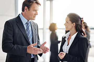 Image showing Business, employees and man with woman, discussion and planning with ideas, teamwork or talking in the workplace. Staff, male supervisor or female manager with happiness, collaboration or partnership