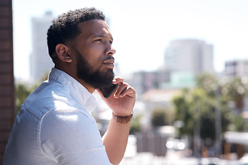 Image showing Serious, black businessman and call on a cellphone in a city or standing outside talking or office overlooking on bokeh. Communication, face and corporate professional on mobile or conversation