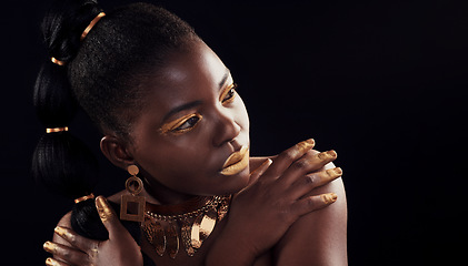 Image showing Beauty, glitter and black woman in studio for makeup, art and confidence on black background. Face, creative and African female model pose with jewelry for wealth, royal and luxury gold aesthetic