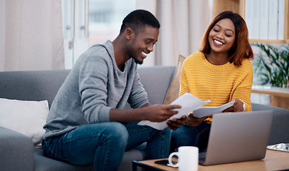 Image showing Home, smile and black couple with paperwork, laptop and discussion with budget, conversation and planning funding. Partnership, man and woman with technology, talking and documents for investments