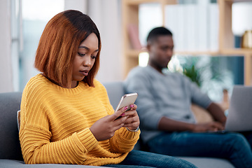 Image showing Relax, phone or technology addiction and a woman on a sofa in the living room of her home with her boyfriend on a blurred background. Mobile, contact and social media with a female person in a house