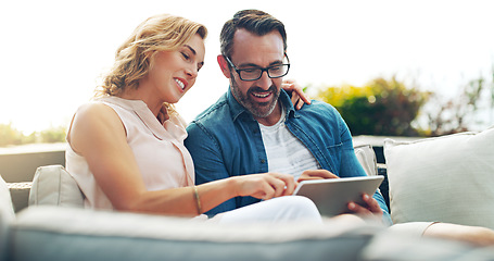 Image showing Couple, sofa and tablet for online shopping, streaming or reading, social media communication or ecommerce. Woman, man and relax together on holiday with technology, movie service or network