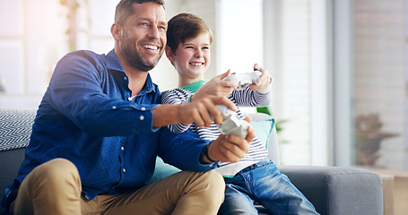 Image showing Father, child and video game on home sofa while happy and excited for challenge and quality time. A man and son or kid together on a couch to play games with a joystick in a family house to relax