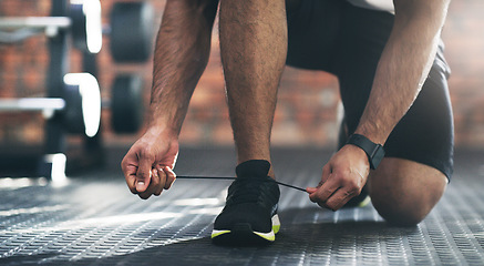 Image showing Closeup, exercise and man tie shoes, fitness and start workout with training, wellness and healthy lifestyle. Zoom, male person or athlete with laces, sneakers and prepare for practice or performance