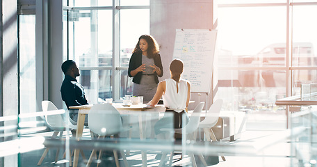 Image showing Business staff and woman in a meeting, presentation or conversation for project development, charts or company progress. Female person, presenter or speaker with a group, brainstorming or share ideas