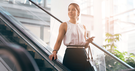 Image showing Business, thinking and woman with a smartphone, escalator and connection for social media, texting and sms. Female person, employee and agent on a moving stairway, cellphone and ideas with thoughts