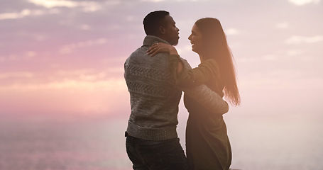 Image showing Couple, dancing and sunset sky at the beach while happy on vacation, holiday or adventure. A man and woman dance to celebrate love, marriage and travel journey or date outdoor in nature with mockup