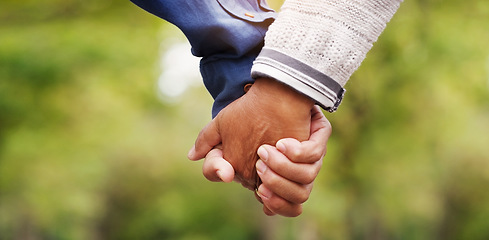 Image showing Closeup, love and couple holding hands, outdoor and relationship with romance, bonding and support. Zoom, partners and man with woman, touching hand and trust with solidarity, marriage and nature