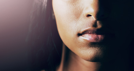 Image showing Sensual, beauty and closeup of woman lips for cosmetic, makeup and natural routine in a studio. Beautiful, cosmetics and zoom of a female model mouth with lipgloss for self care by a black background