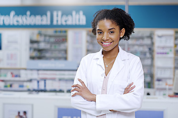 Image showing Happy, arms crossed and portrait of black woman in pharmacy for medical, pills and retail. Medicine. healthcare and trust with pharmacist in drug store for product, wellness and expert advice