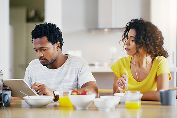 Image showing Tablet, breakfast and couple in kitchen online for social media, internet and app in morning. Marriage, love and curious woman looking at man on digital tech for website browse, search and network