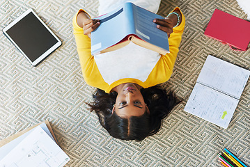 Image showing Student books, top view floor and woman reading info, school research or knowledge for college education. Learning, university scholarship study and gen z person studying, relax and lying at home