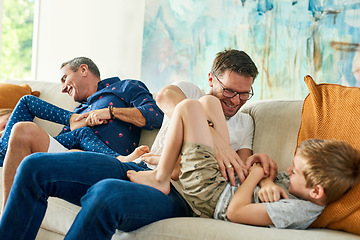 Image showing Gay parents, family and tickling in living room with dads and kids together with laugh. Parent love, bonding and care with father, papa and children in a home with a smile or fun lgbt people in house