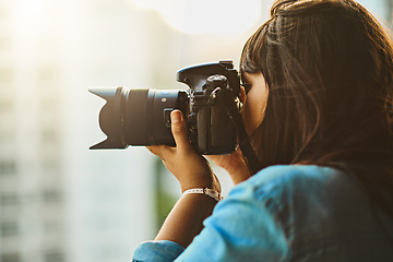 Image showing Travel, photographer or woman with a camera, city or capture memory on a vacation. Female person, professional or girl with photography equipment, outside or shooting on holiday, pictures and journey