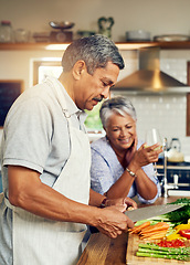 Image showing Cooking, old man and happy woman with wine at kitchen counter, healthy food and marriage bonding in home. Drink, glass and vegetables, senior couple with happiness vegetable meal prep and retirement.