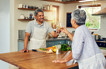 Image showing Cheers, wine and old couple in kitchen, cooking healthy food together with smile, diet and health. Toast, senior woman and man with drinks in glass, meal prep and happiness with love in retirement.