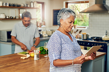 Image showing Old woman in kitchen with man, tablet and cooking healthy food together in home with nutrition. Digital recipe, smile and senior couple in house with meal prep, happiness and wellness in retirement.