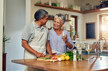 Image showing Love, cooking and old couple with wine in kitchen, healthy food and marriage bonding together in home. Drink, glass and senior woman with man, meal prep and vegetables for wellness diet in retirement