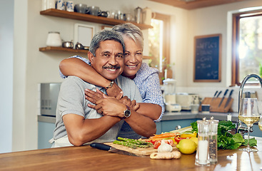 Image showing Love, hug and cooking, portrait of old couple in kitchen with healthy food, happiness and diet together in home. Smile, senior man and woman in house for meal prep, embrace and wellness in retirement