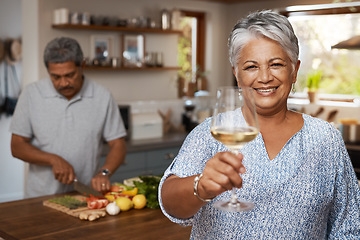 Image showing Portrait of old couple in kitchen, wine and cooking, cheers to healthy food together in home. Toast, smile and senior woman with glass in house with man, meal prep and happy lunch diet in retirement