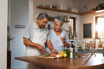 Image showing Vegetables, cooking and senior couple with wine in kitchen, healthy food and marriage bonding together in home. Drink, glass and happy woman with old man, meal prep and wellness diet in retirement.