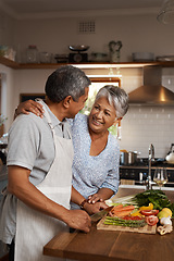 Image showing Happiness, vegetables and old man with woman in kitchen, embrace and healthy marriage bonding in home for dinner. Love, help and cooking, senior couple with smile, hug and happy time in retirement.