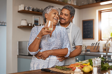 Image showing Hug, old woman and man in kitchen with wine glass, happiness and cooking healthy vegetable dinner together. Smile, love and food, happy senior couple in retirement with drink, vegetables and wellness