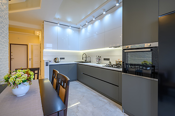 Image showing Luxury white and dark grey modern kitchen interior