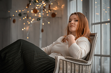 Image showing Beauty portrait of finnish scandinavian type caucasian woman sitting on chair