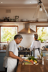 Image showing Help, vegetables and old man with woman at kitchen counter, cooking and healthy marriage bonding in home. Marriage, love and food, senior couple at meal prep time for vegetable dinner in retirement.