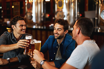 Image showing Beer, cheers and men drinking with friends at social event in a restaurant with happiness. Alcohol, glasses and toast at a pub at happy hour with smile and conversation with drinks and celebration