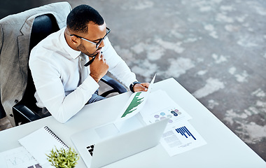 Image showing Financial report, laptop and black business man in his office or finance analyst or data graph and employee on desk. Insight, fintech and professional on pc or technology or stock market and top view